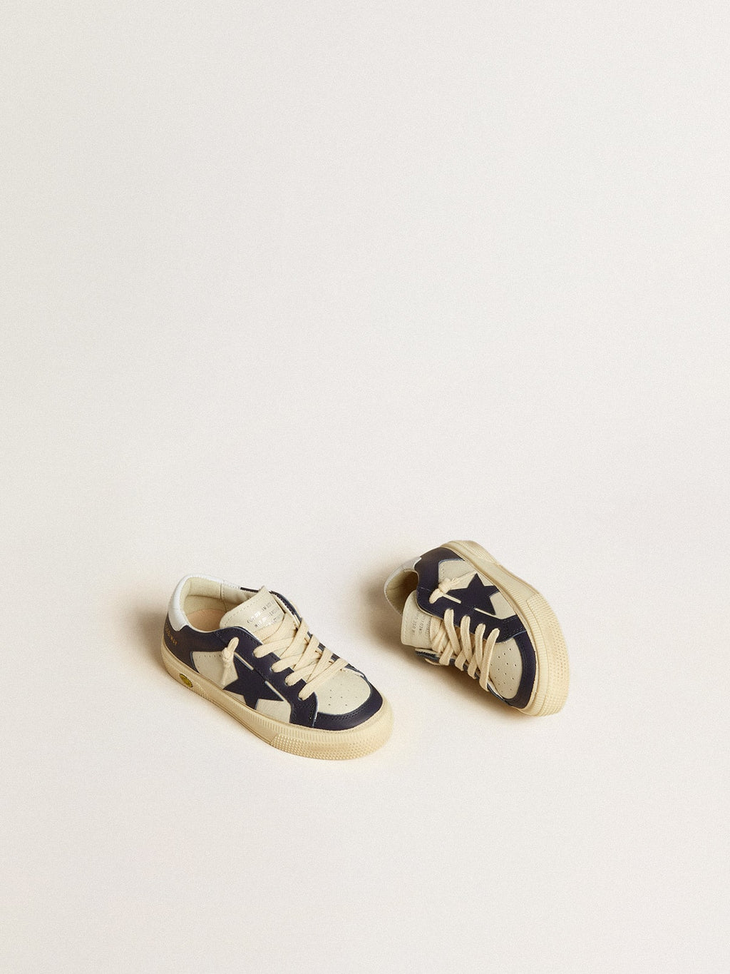 May Young in white and blue leather with leather star and heel tab| Golden Goose