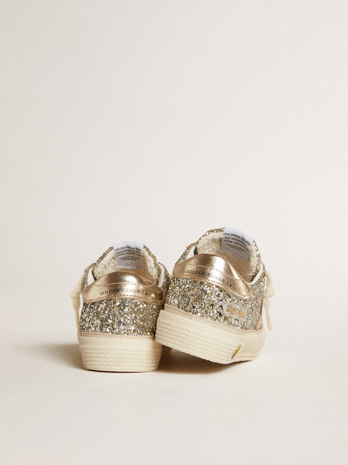 May Young in platinum glitter with metallic leather star and heel tab| Golden Goose