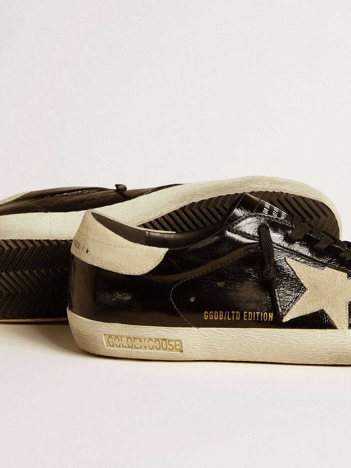 Men's Super-Star LTD in black patent leather with suede star and heel tab| Golden Goose
