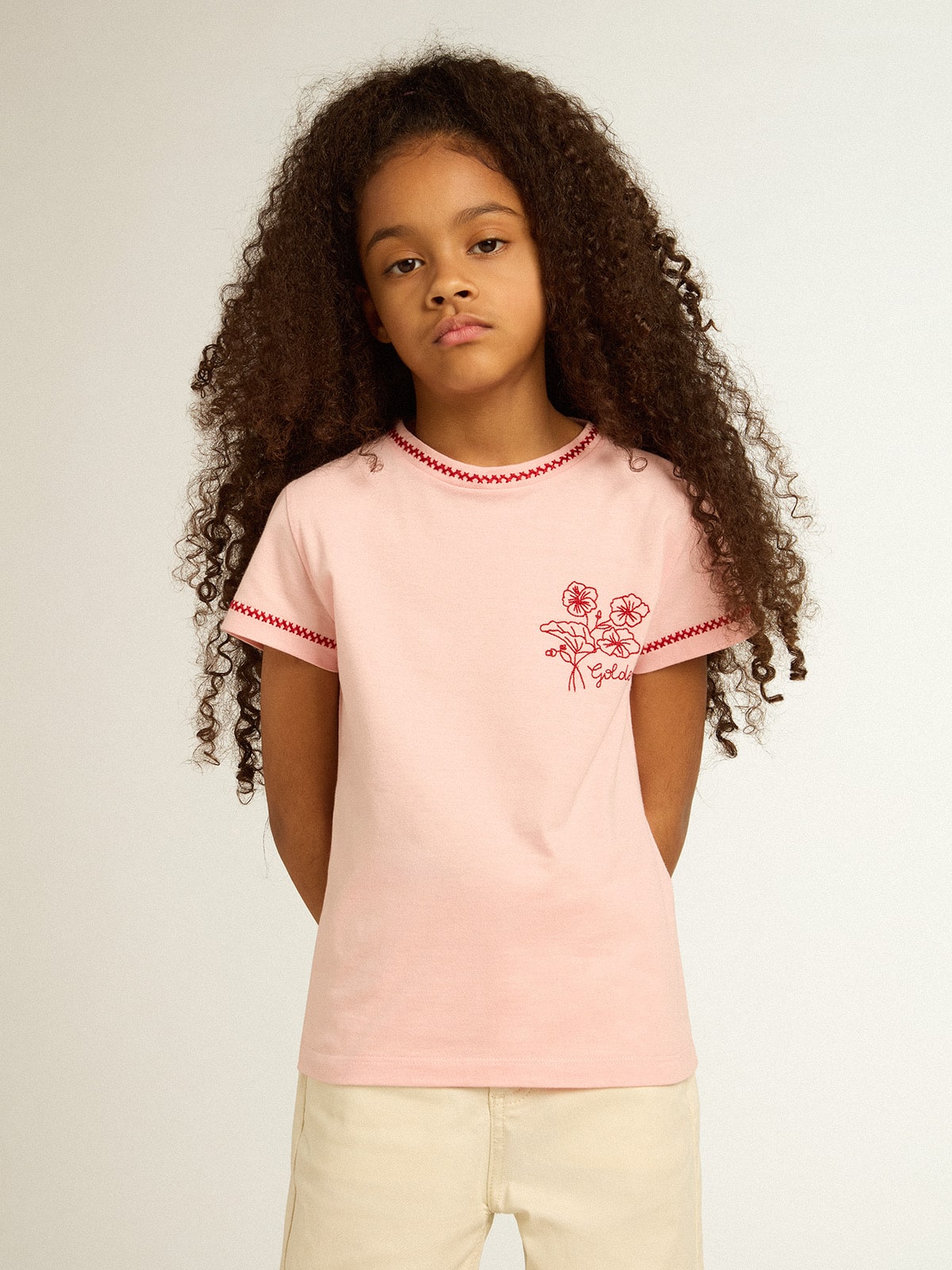 Pink T-shirt with red trim and embroidered flower on the heart| Golden Goose