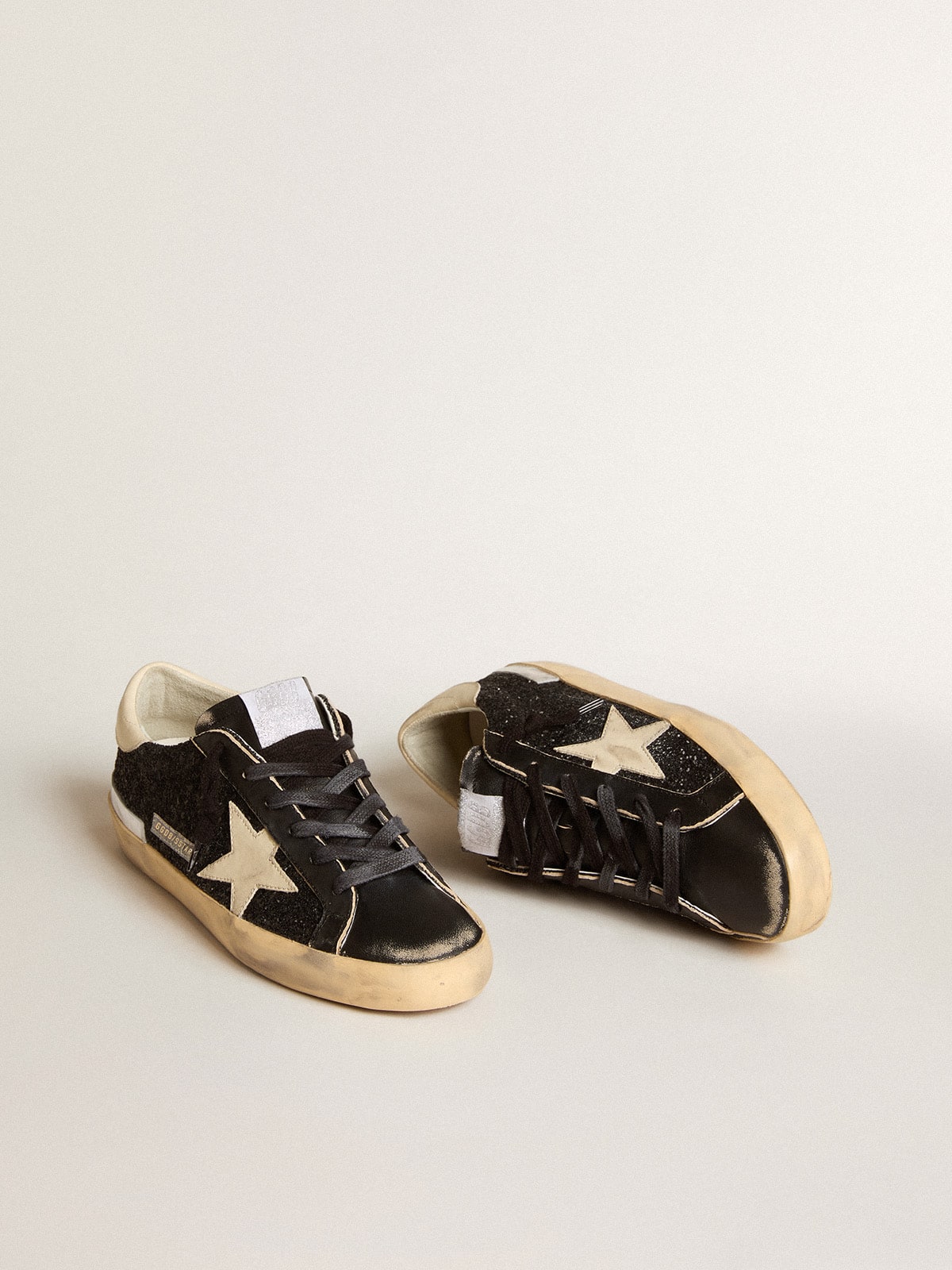 Super-Star in black glitter and nappa with cream leather star and heel tab| Golden Goose