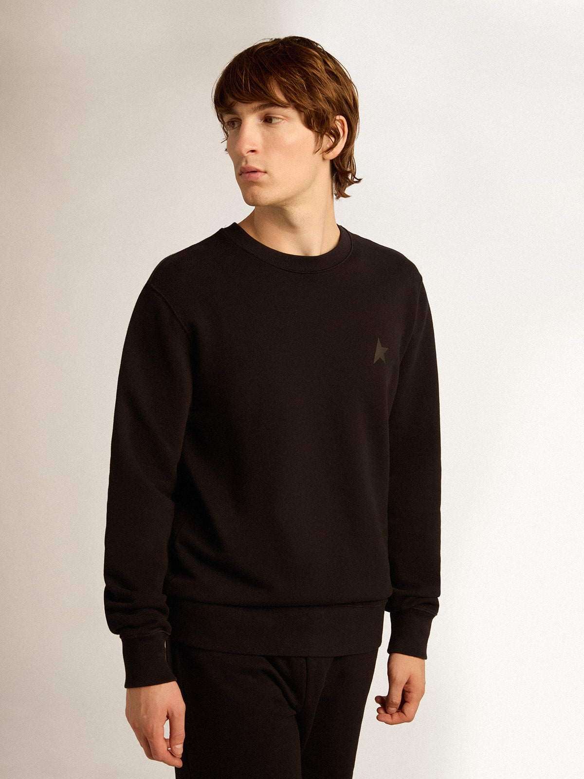 Black Archibald Star Collection sweatshirt with tone-on-tone star on the front| Golden Goose