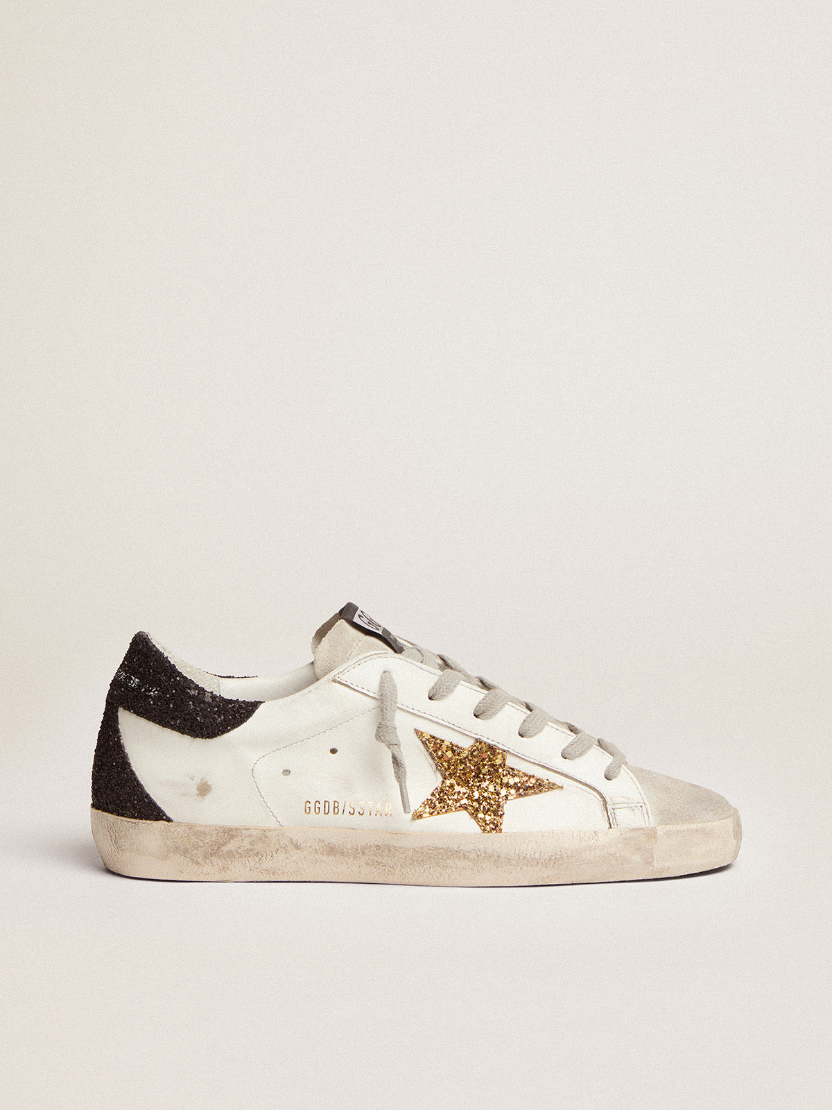Women's Super-Star with gold star and black glitter heel tab| Golden Goose