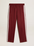 Men's burgundy joggers with stars on the sides| Golden Goose