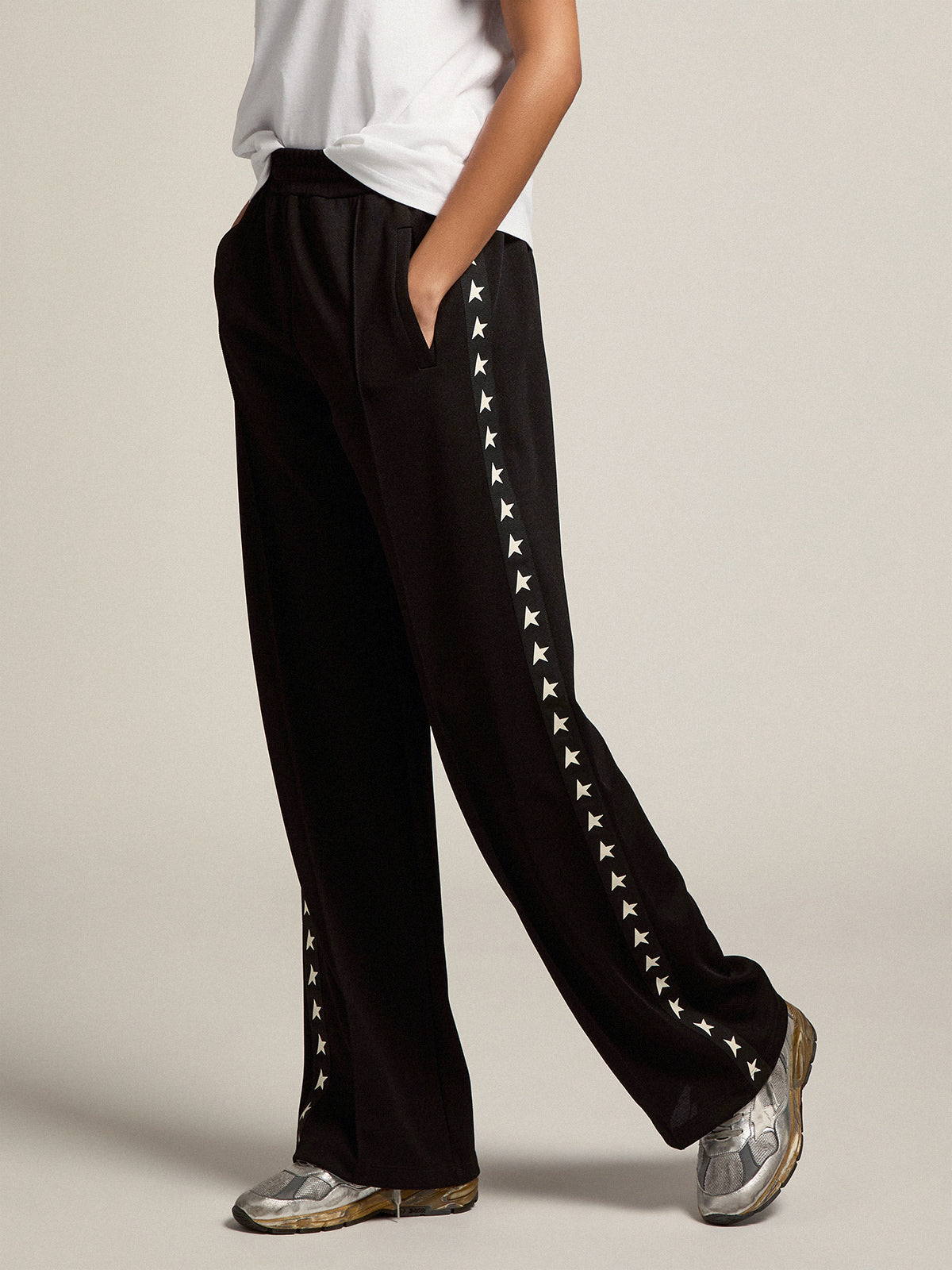 Women's black joggers with white stars on the sides| Golden Goose