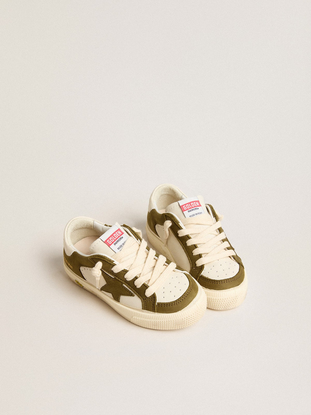 May Young in white and military green leather| Golden Goose