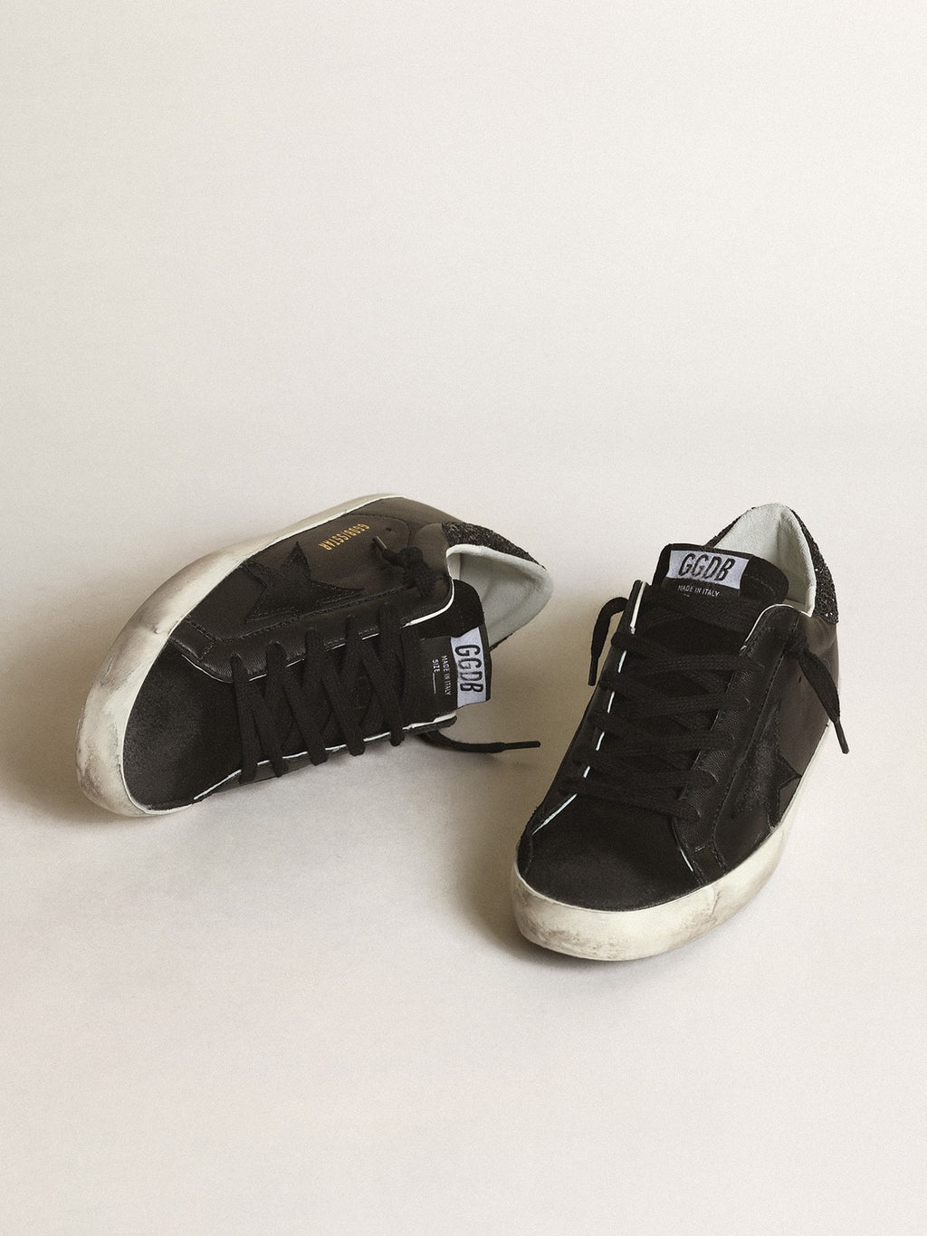 Women's Super-Star in black nappa with black star and glitter heel tab| Golden Goose