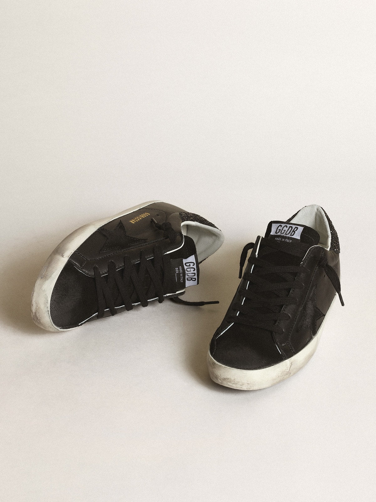 Women's Super-Star in black nappa with black star and glitter heel tab| Golden Goose