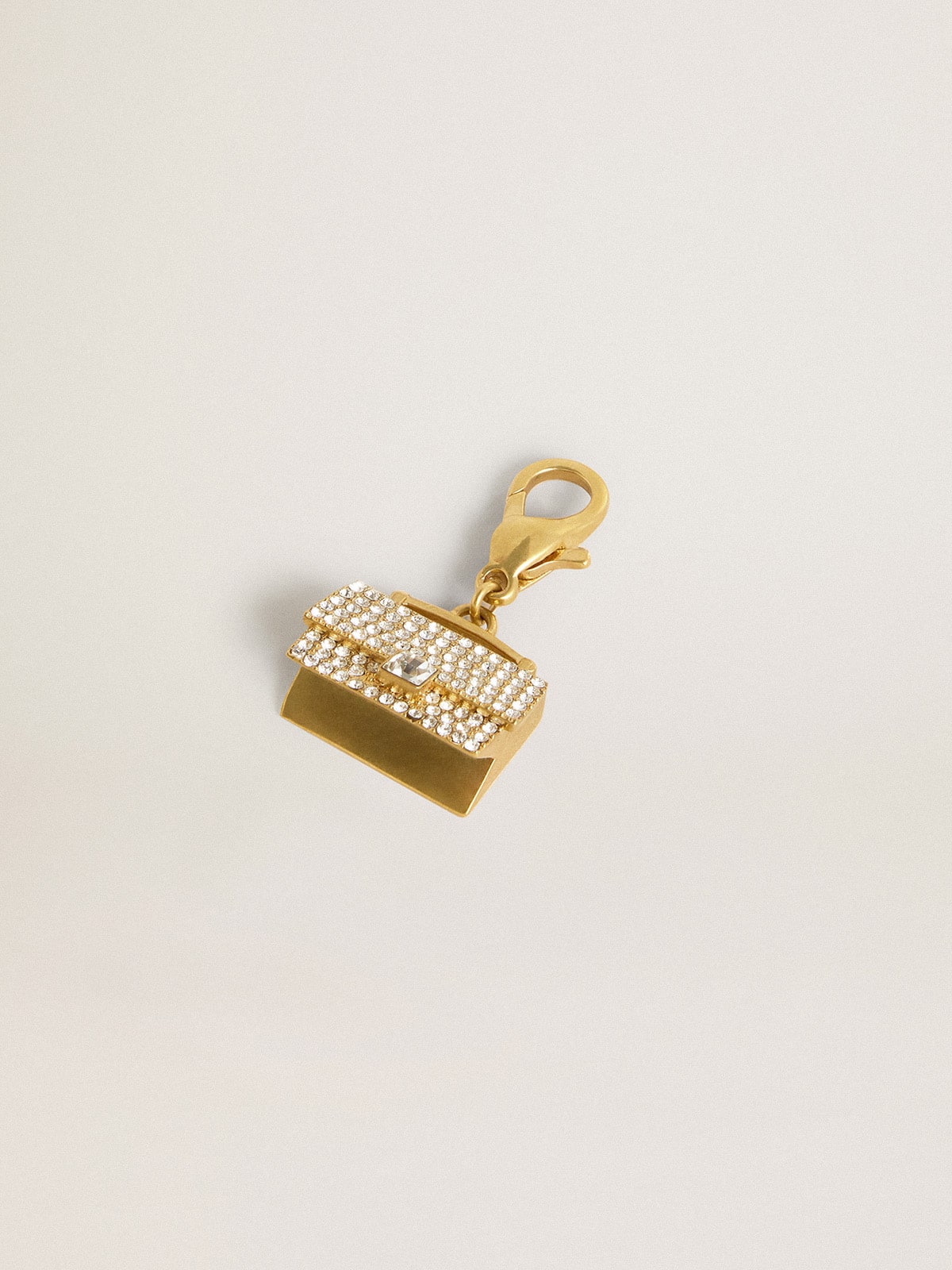 Purse-shaped charm in gold-colored brass with crystals| Golden Goose
