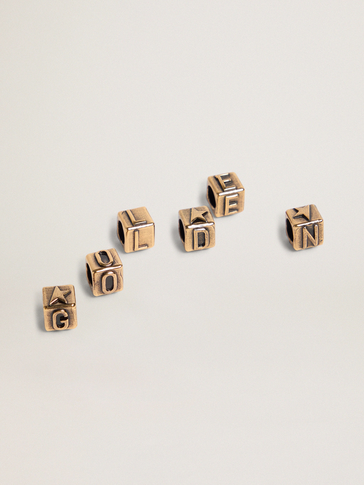 Women's cubic charms in antique gold color with letters of the alphabet| Golden Goose