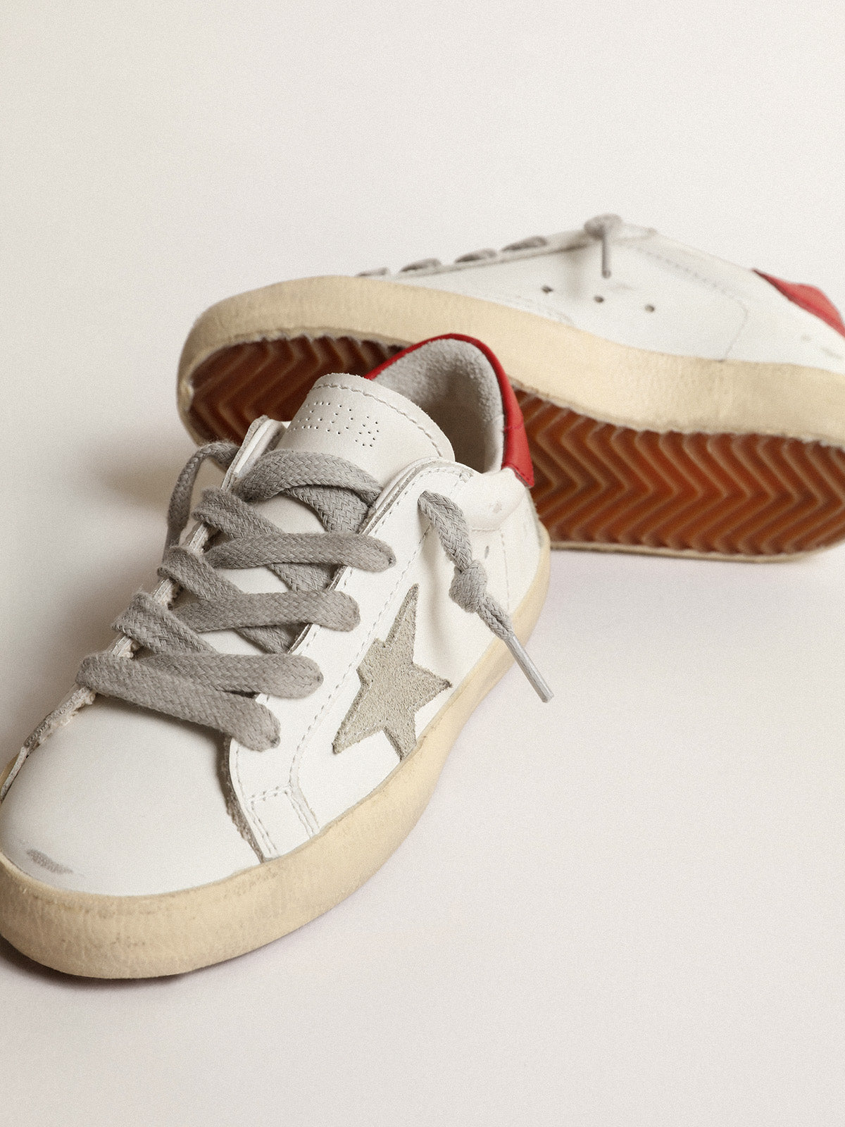 Super-Star Junior with suede star and red leather heel tab| Golden Goose