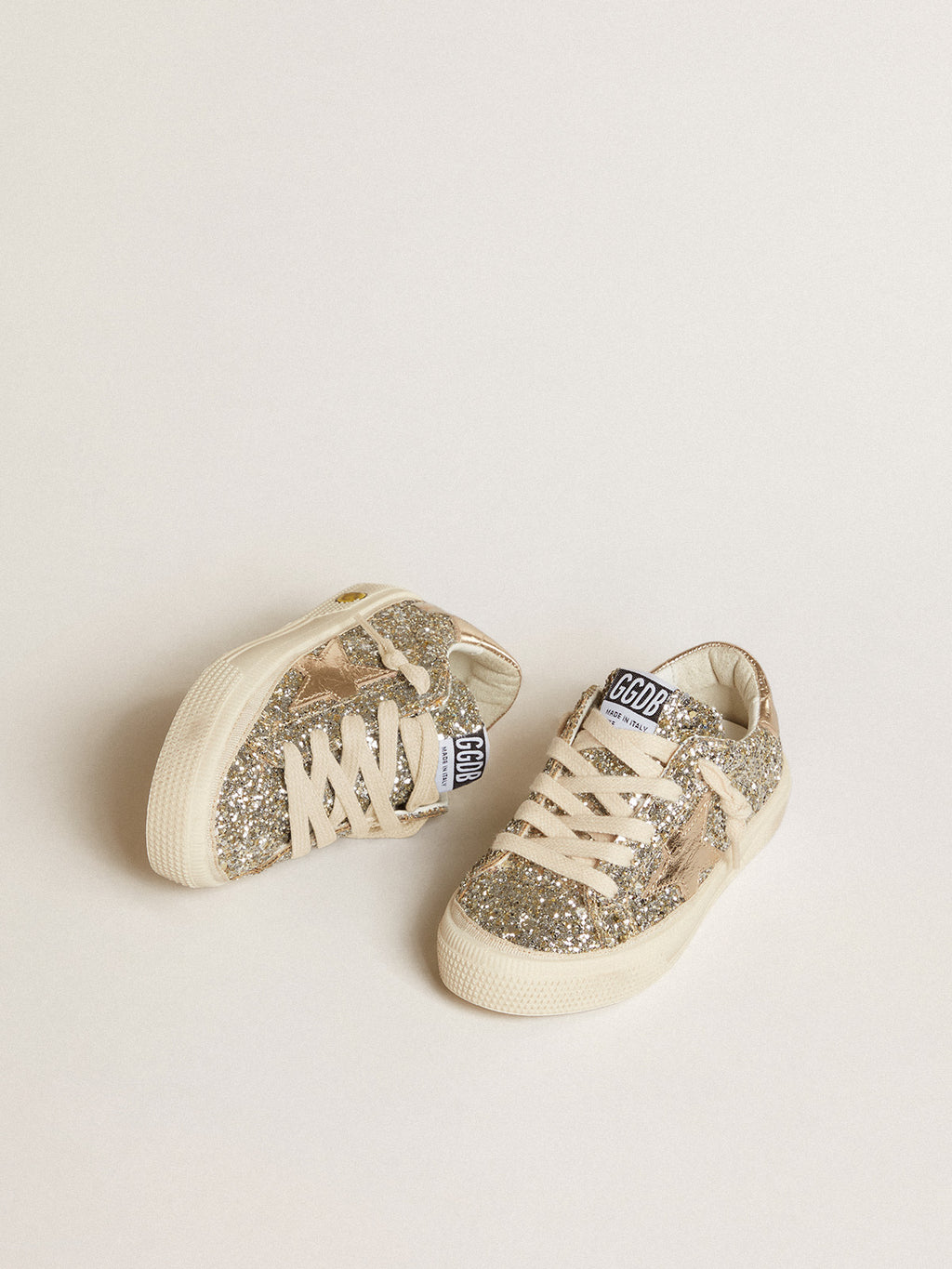 May Young in platinum glitter with metallic leather star and heel tab| Golden Goose