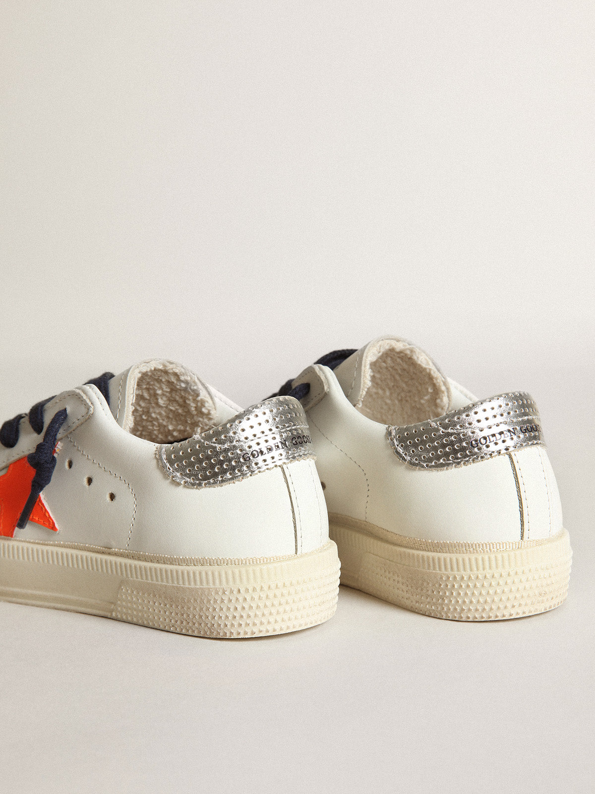 Young May with fluorescent orange leather star and perforated heel| Golden Goose