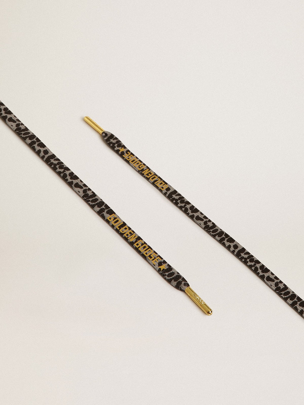 Gray and black animal-print laces with contrasting gold logo| Golden Goose