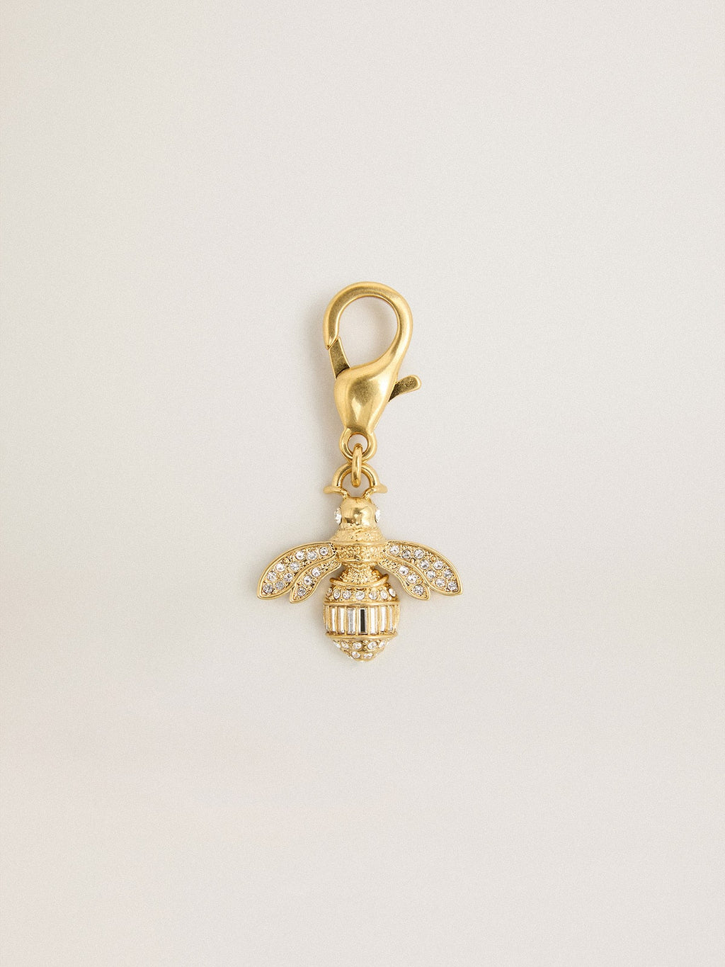 Bee-shaped charm in gold-colored brass with crystals| Golden Goose
