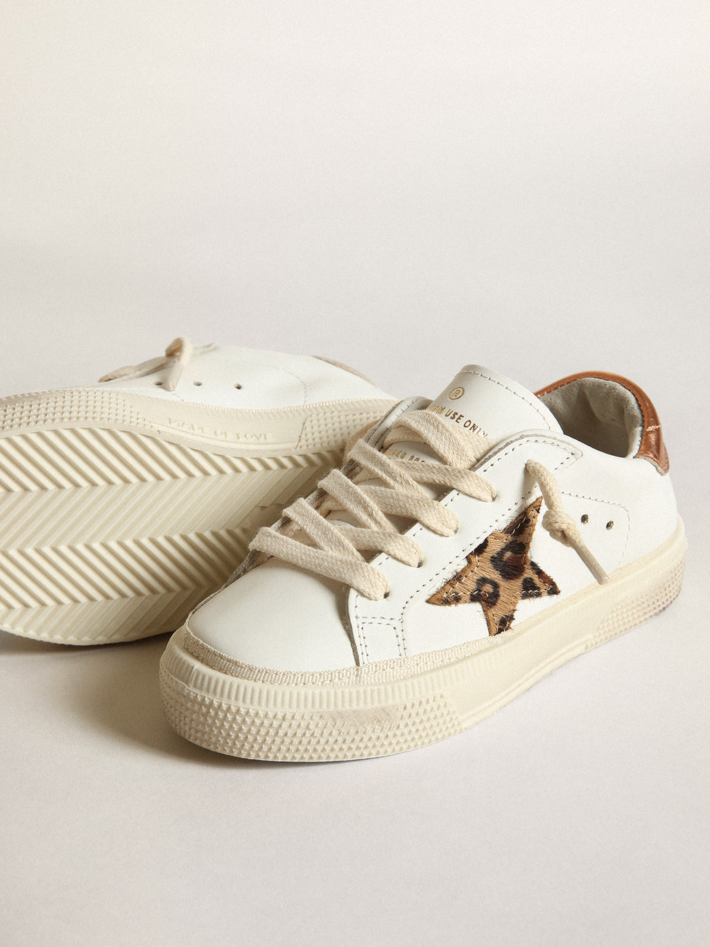 Young May with leopard print pony skin star and copper-colored heel| Golden Goose