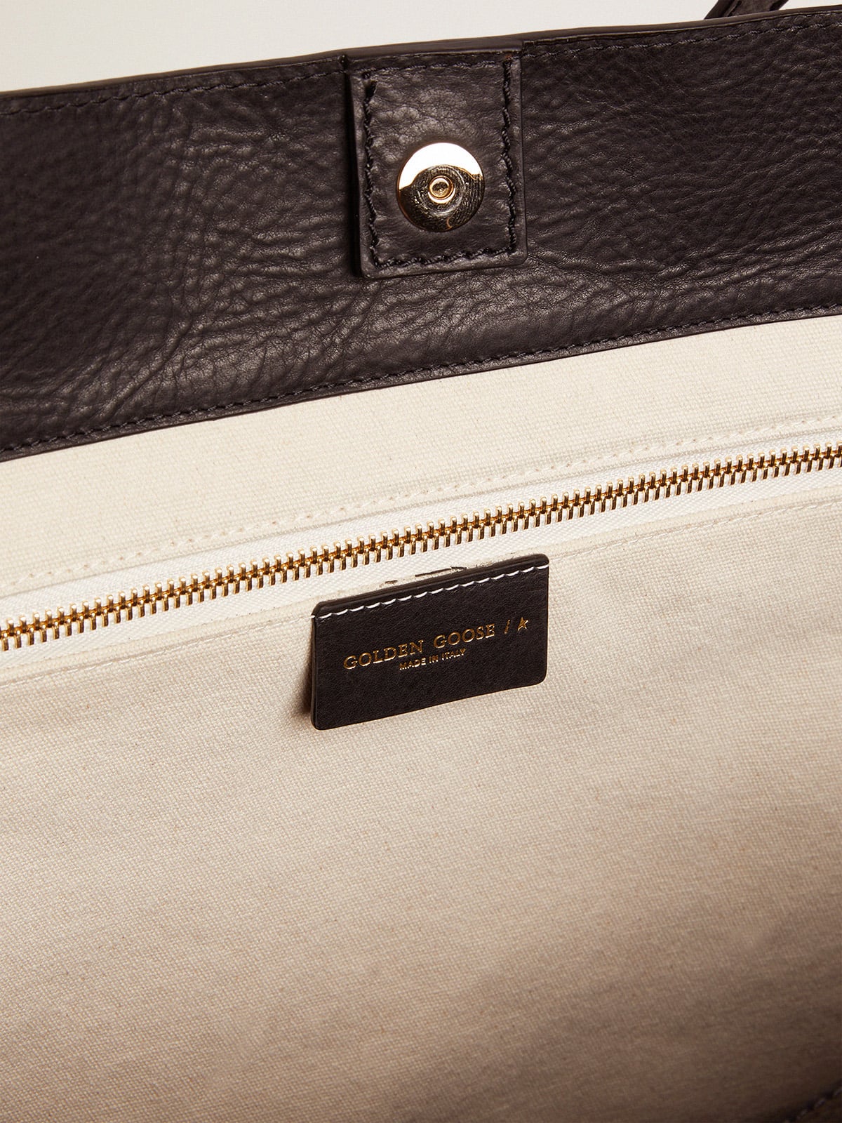 Pasadena Bag in black hammered leather with gold logo on the front| Golden Goose
