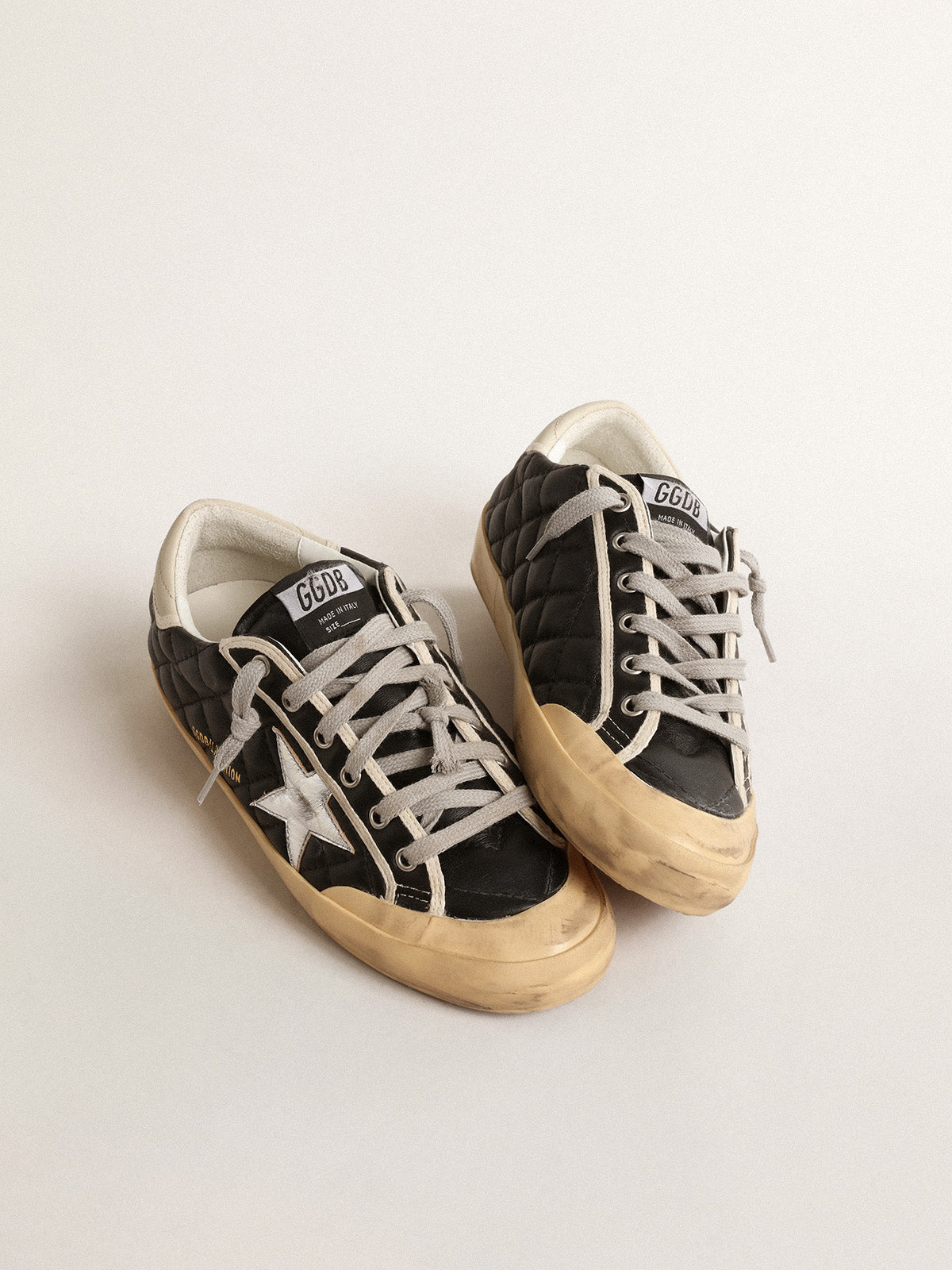 Super-Star Penstar in black matelassé nappa with silver star| Golden Goose
