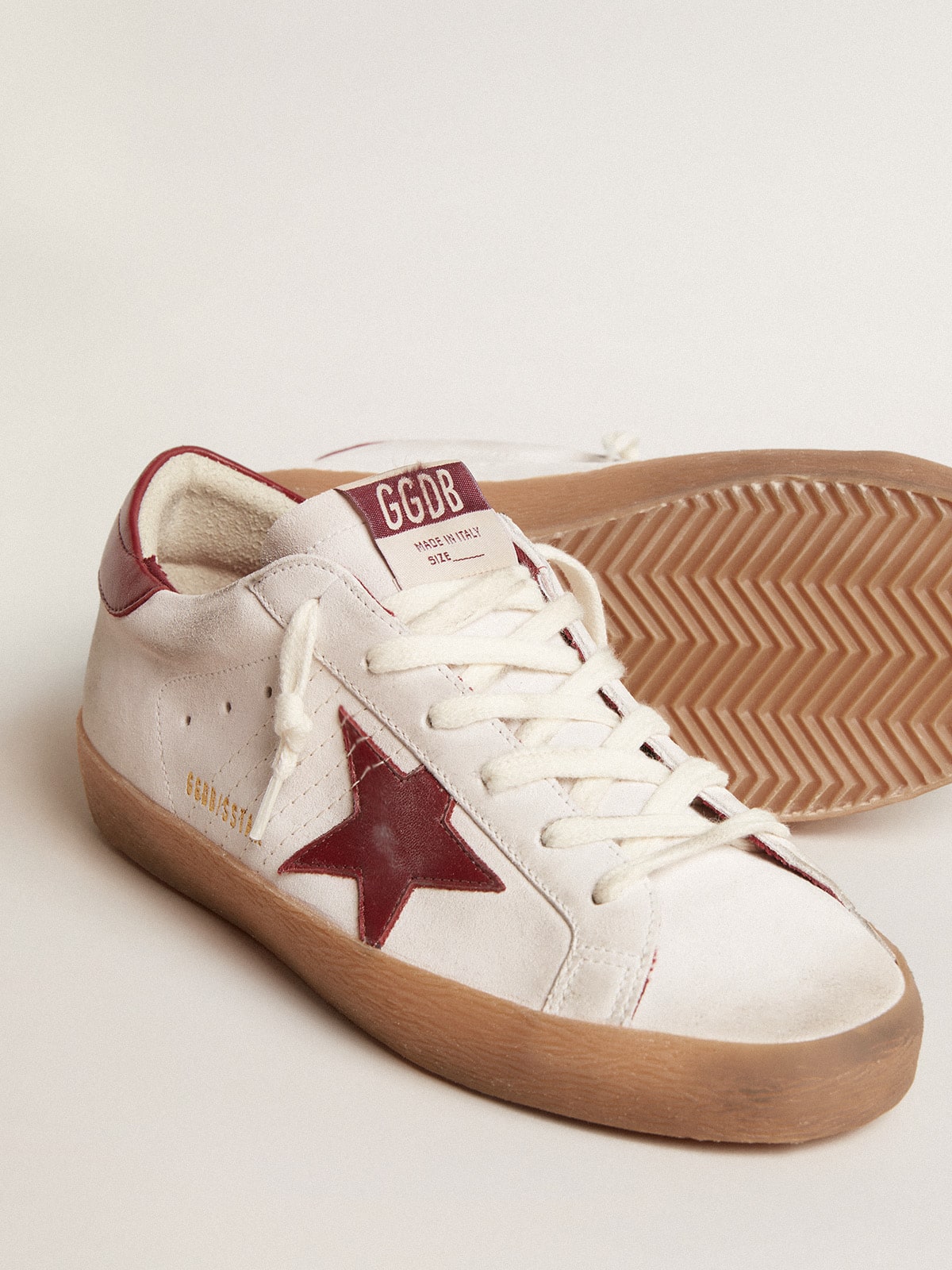 Super-Star in white suede with burgundy leather star and heel tab| Golden Goose