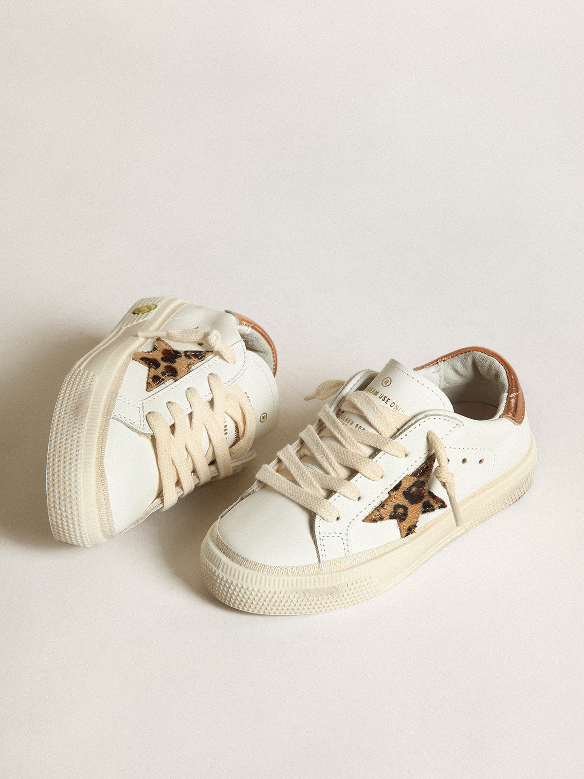 Young May with leopard print pony skin star and copper-colored heel| Golden Goose