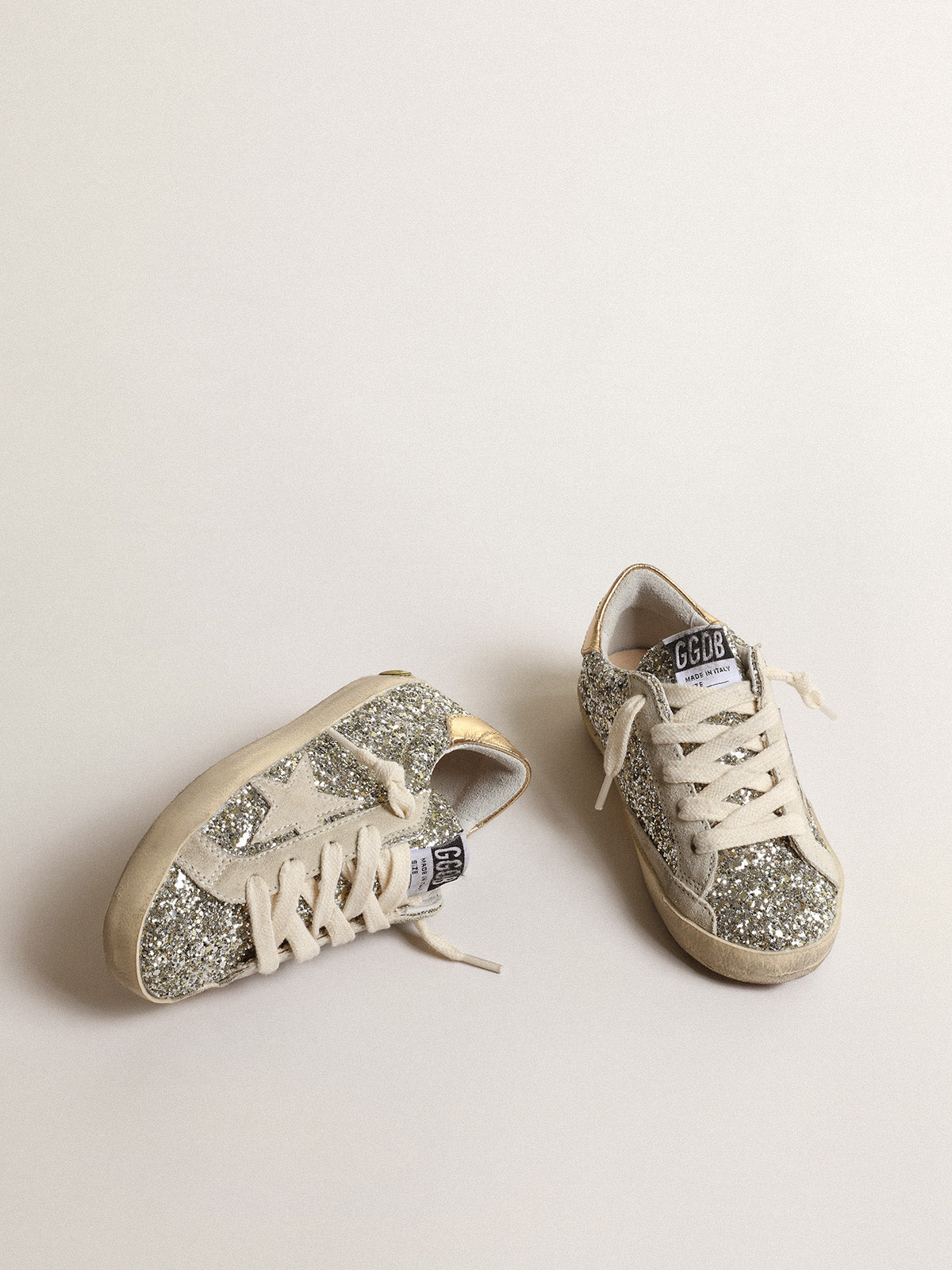 Super-Star Junior in glitter with a suede star and gold heel tab| Golden Goose