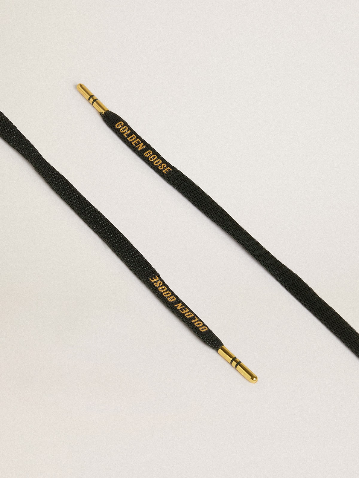 Black cotton laces with contrasting gold-colored logo| Golden Goose