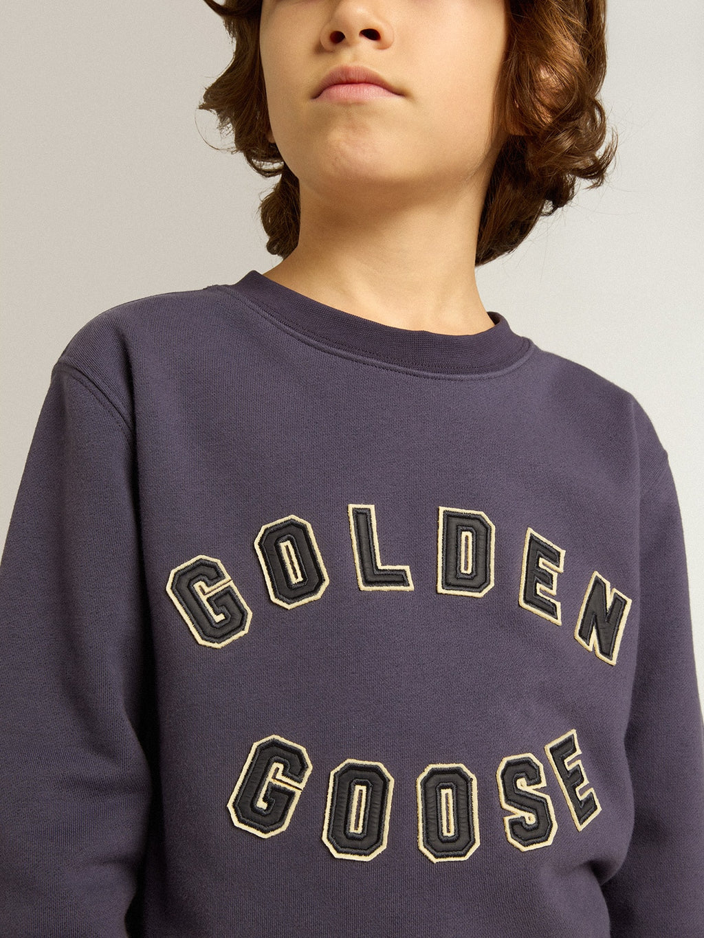 Blue-violet sweatshirt with Golden Goose lettering on the front| Golden Goose
