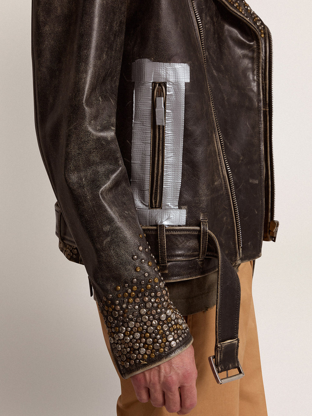 Men's leather biker jacket with hammered studs and adhesive tape| Golden Goose