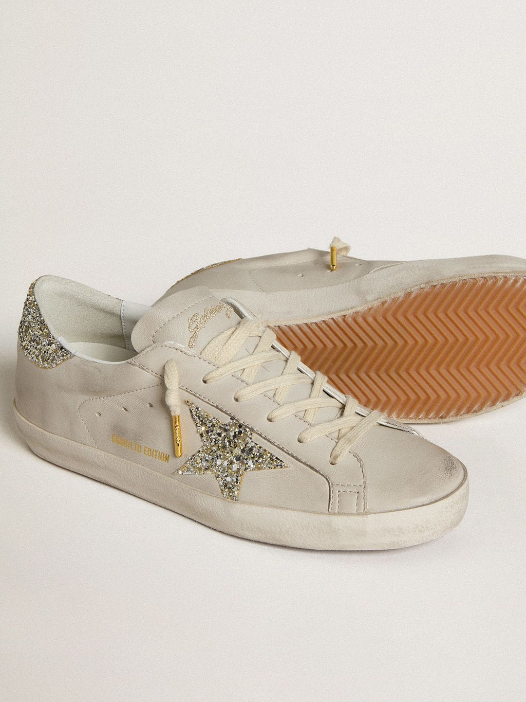 Women's Super-Star LTD in ivory nappa leather with platinum glitter star and heel tab| Golden Goose
