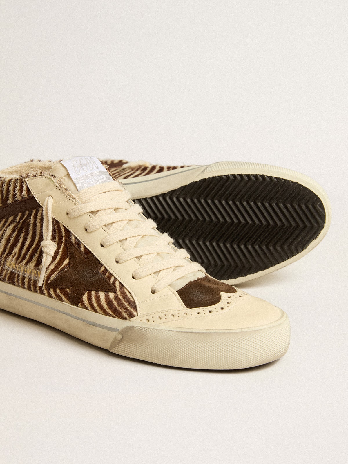Mid Star LTD in zebra-print pony skin with suede star and brown flash| Golden Goose