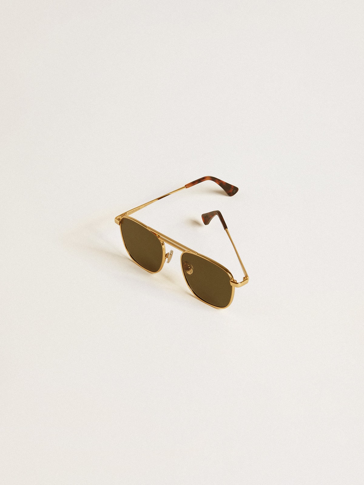 Aviator style sunglasses with gold frame and green lenses| Golden Goose