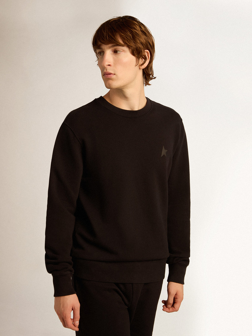 Black Archibald Star Collection sweatshirt with tone-on-tone star on the front| Golden Goose
