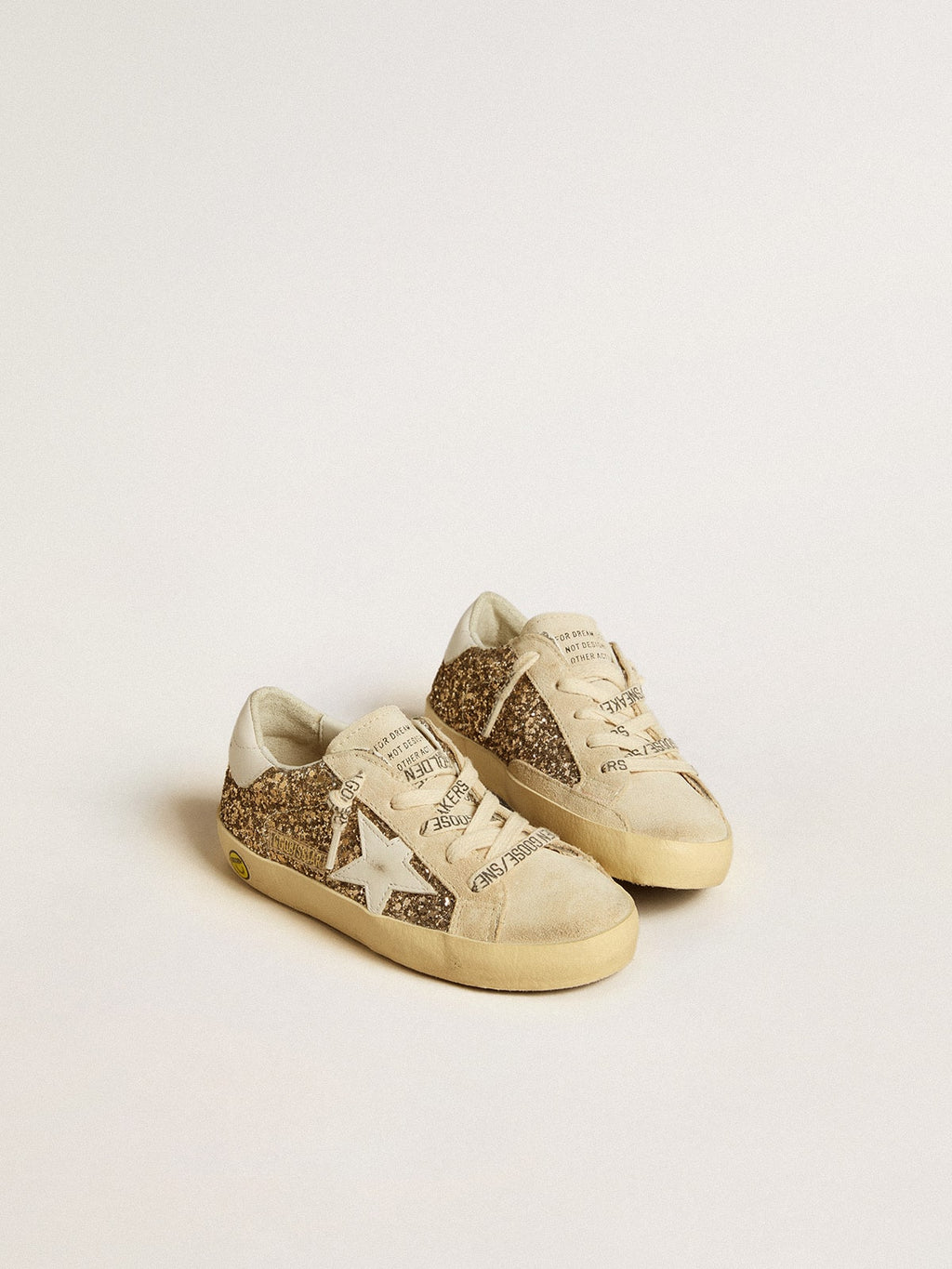 Super-Star Young in gold glitter with white leather star and heel tab| Golden Goose