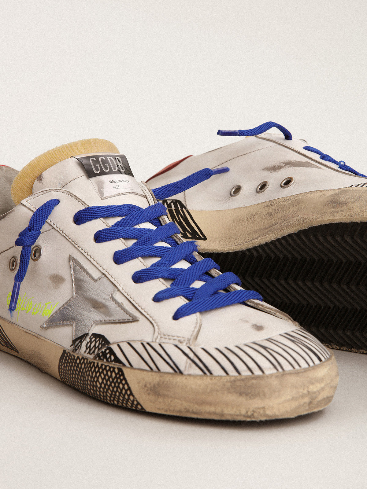 Super-Star LAB sneakers in white leather and multi-foxing-effect print| Golden Goose