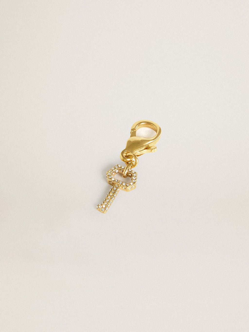 Key-shaped charm in gold-colored brass with crystals| Golden Goose