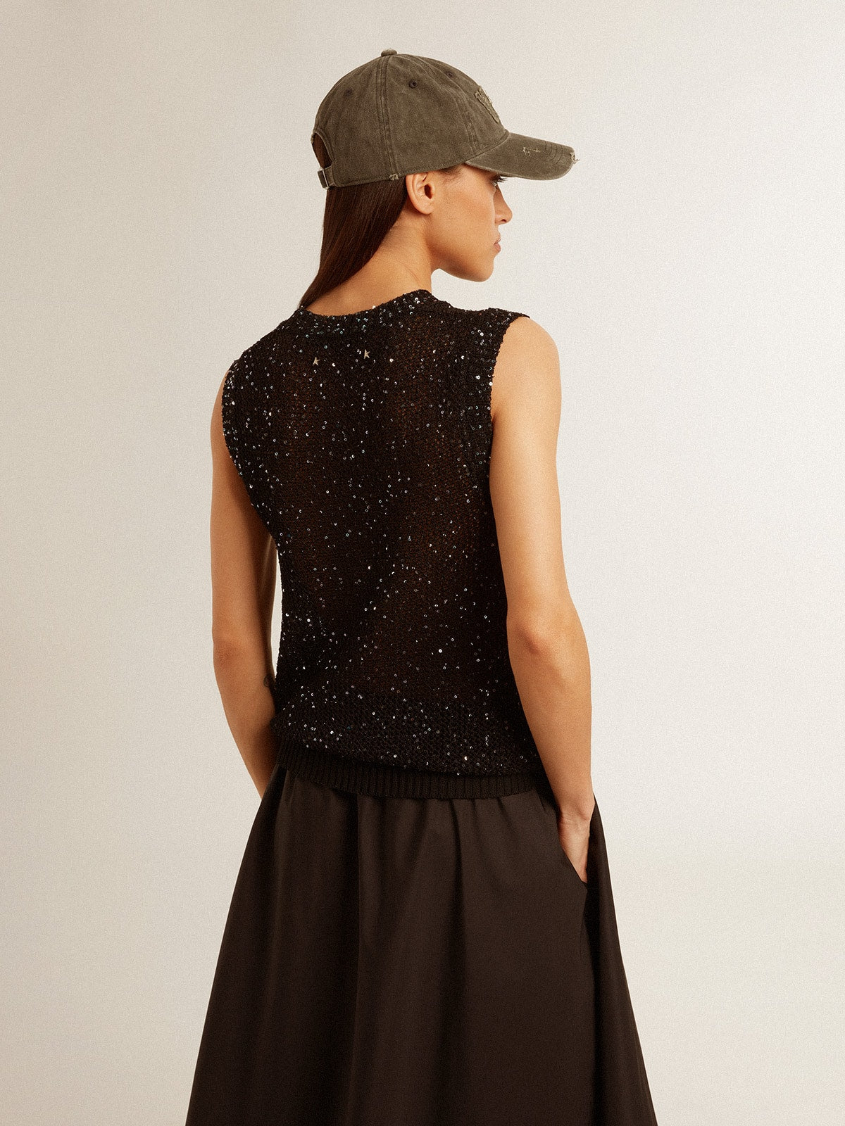 Black mesh knit top with sequins and contrasting details