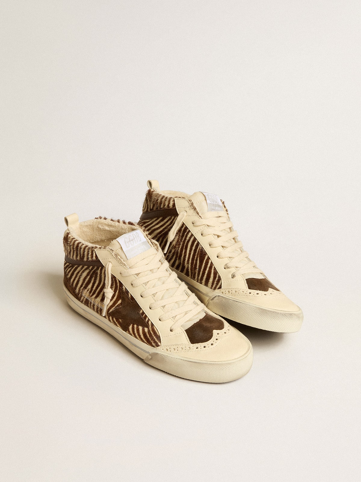 Mid Star LTD in zebra-print pony skin with suede star and brown flash| Golden Goose