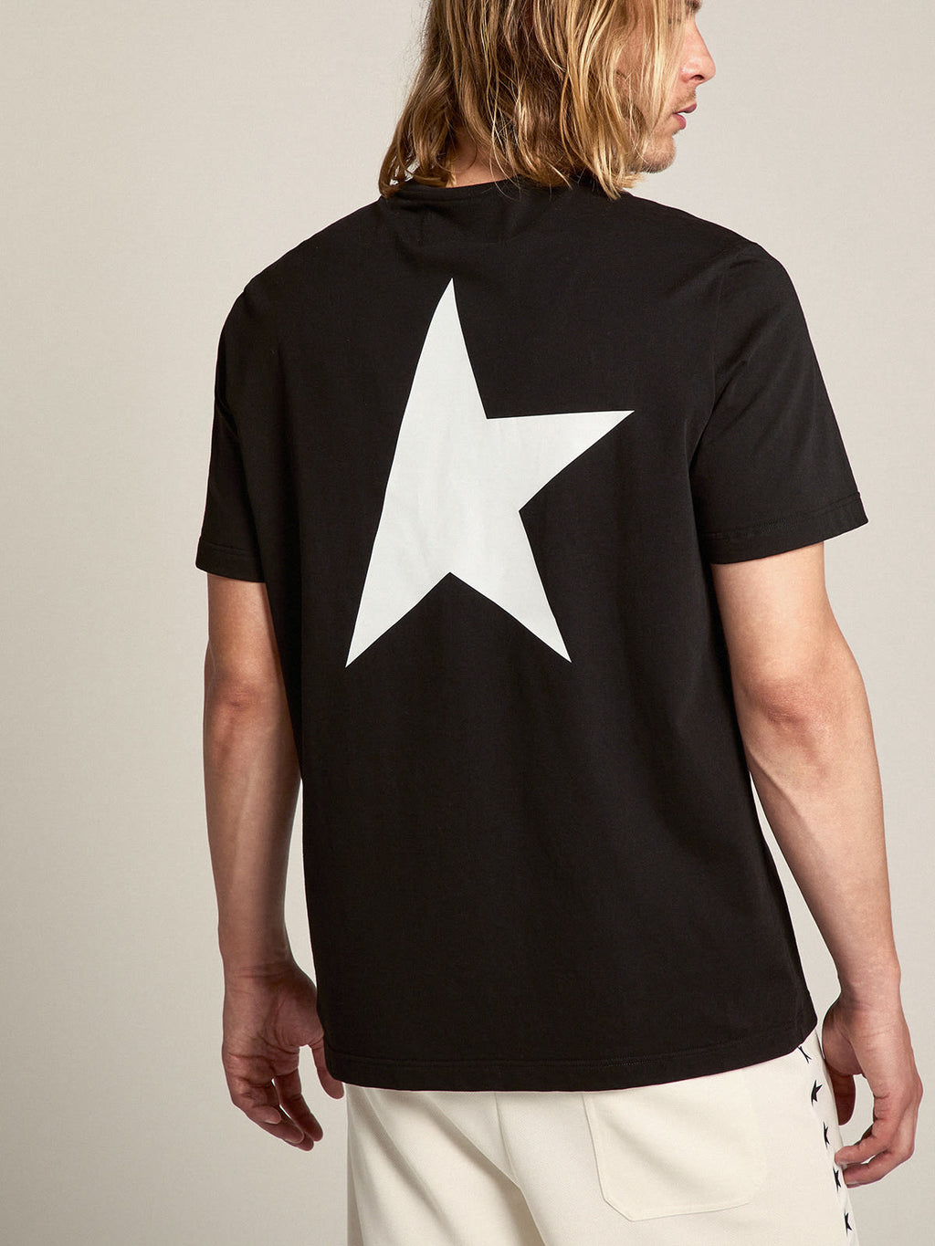 Men's black T-shirt with contrasting white logo and star| Golden Goose