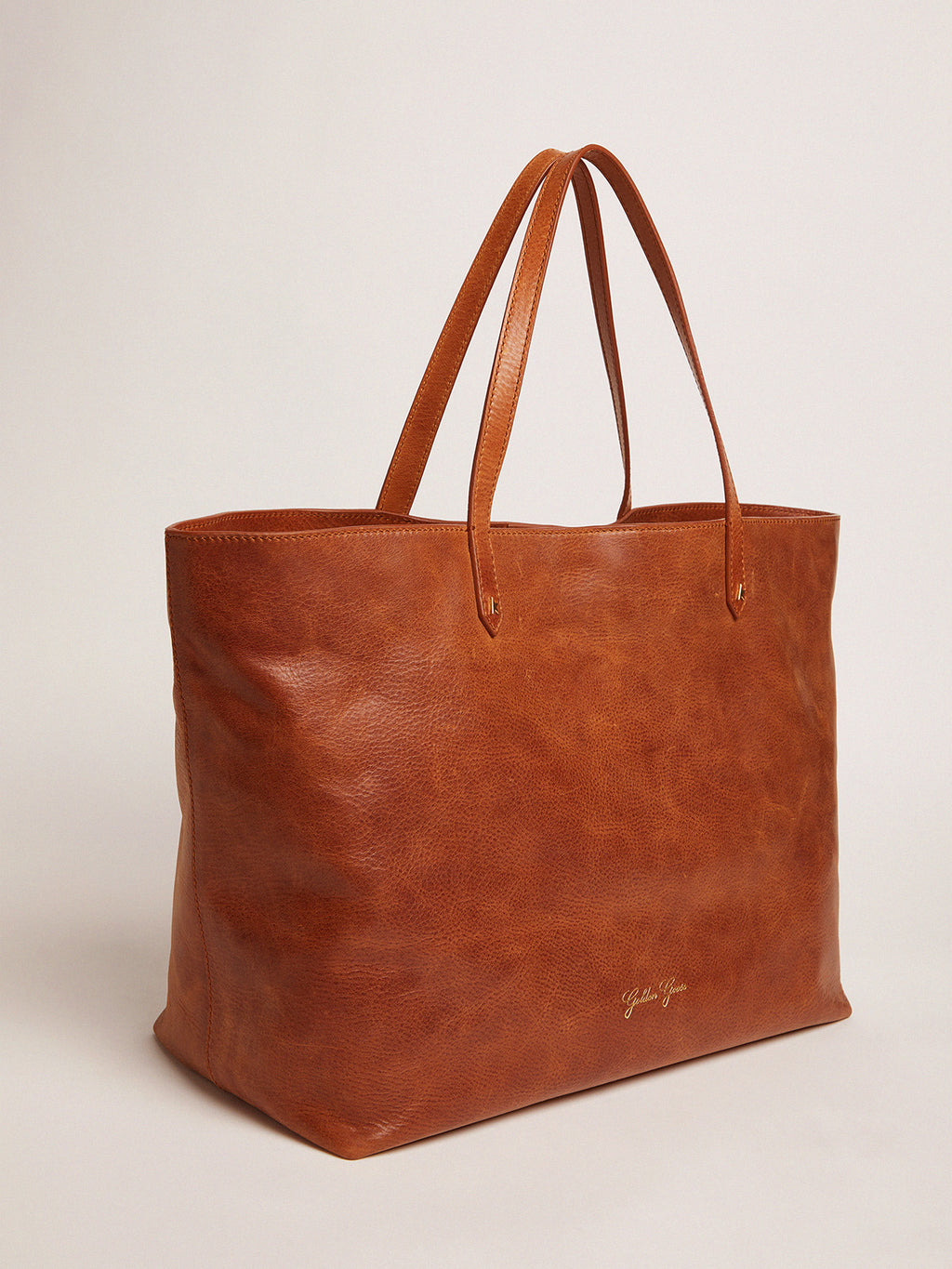 Pasadena Bag in tan-colored glossy leather with gold logo on the front| Golden Goose