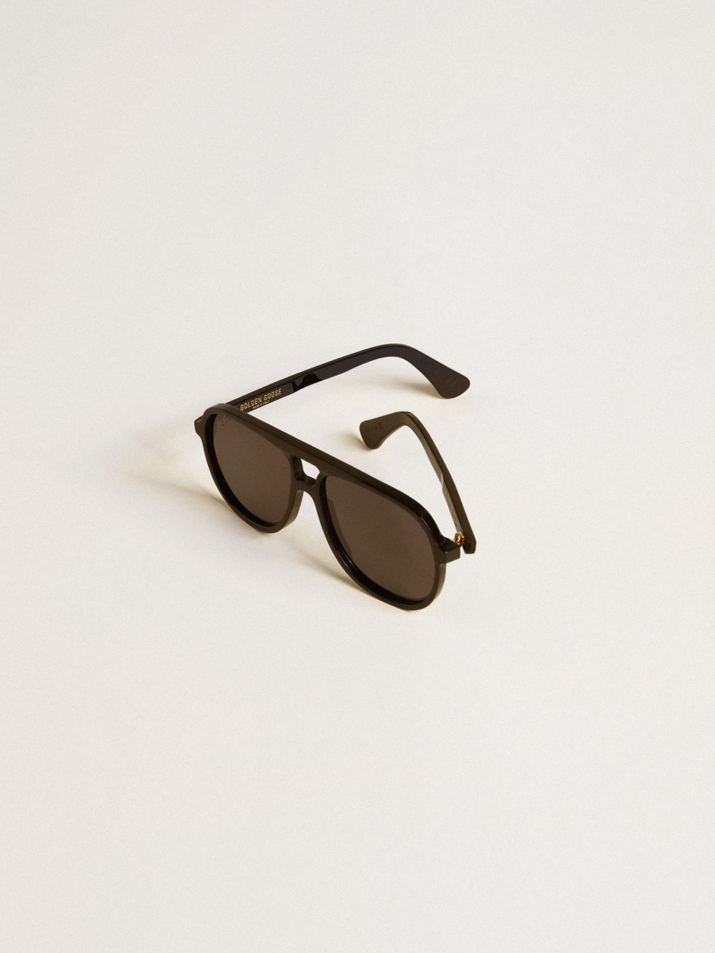 Aviator style sunglasses with black frame and lenses| Golden Goose