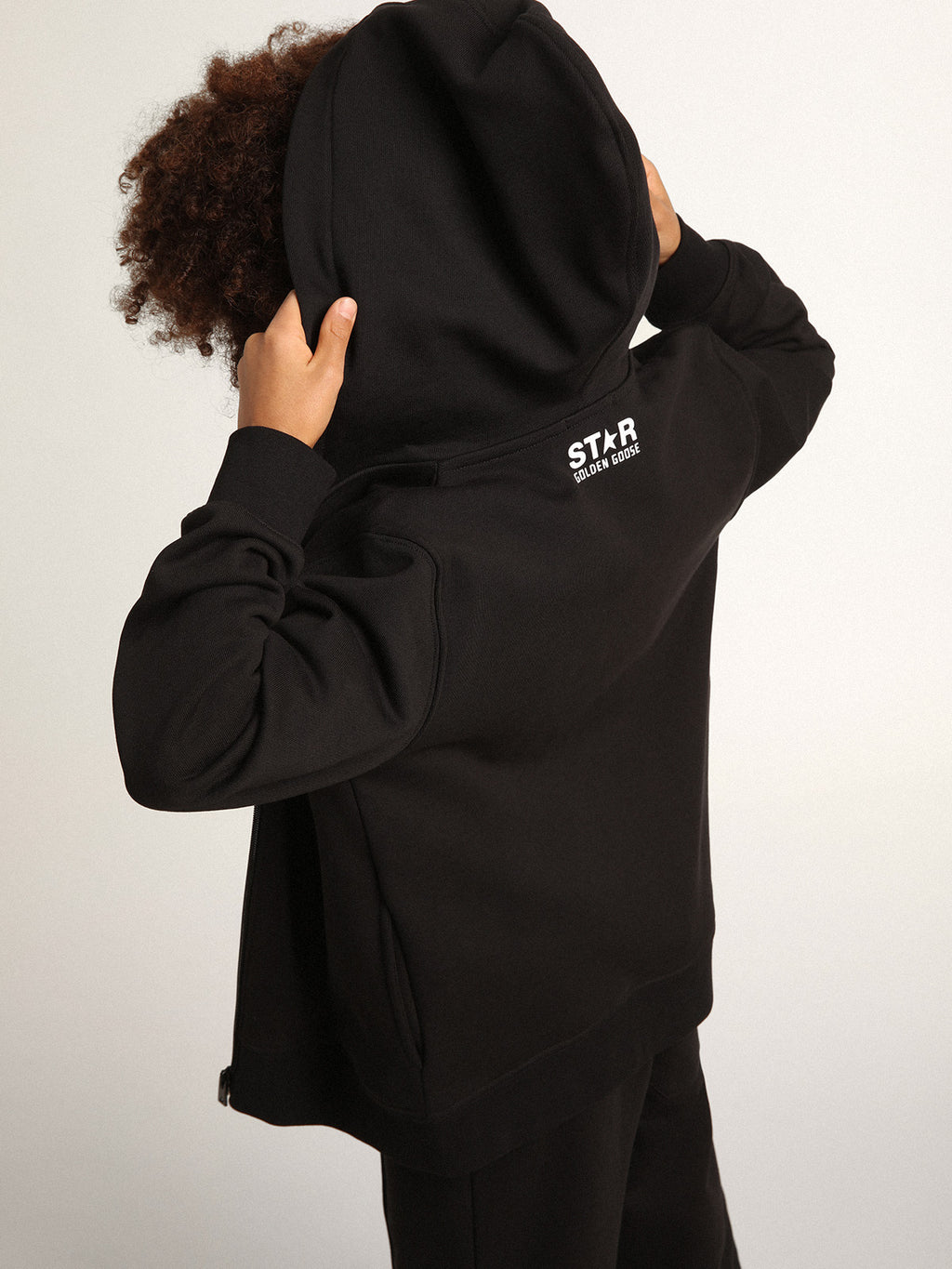 Black hooded sweatshirt with contrasting white star and logo| Golden Goose
