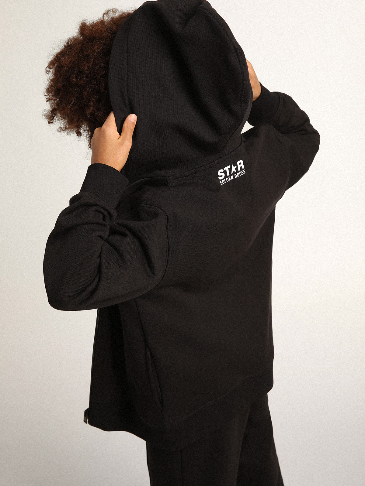 Black hooded sweatshirt with contrasting white star and logo| Golden Goose