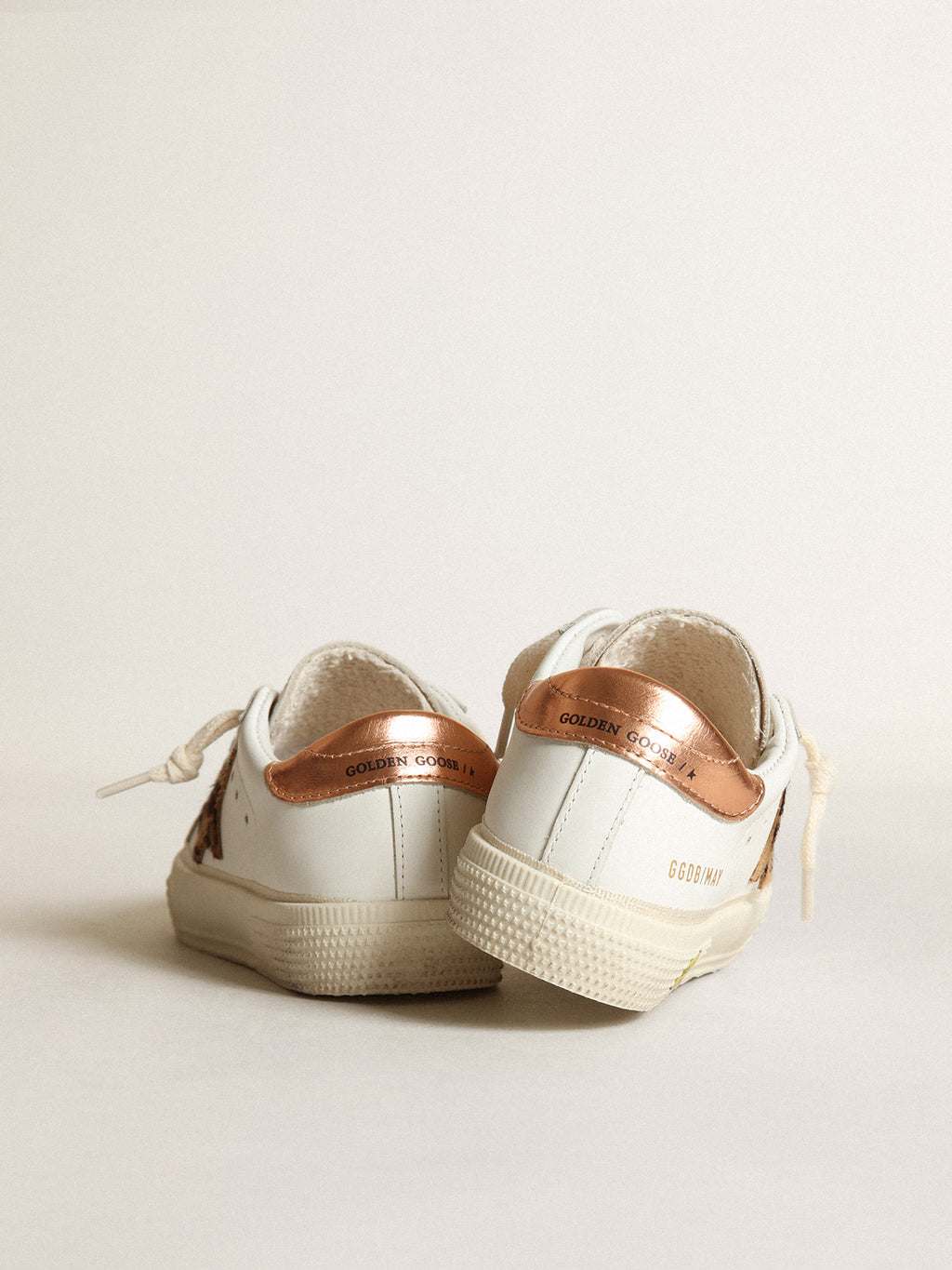 Young May with leopard print pony skin star and copper-colored heel| Golden Goose