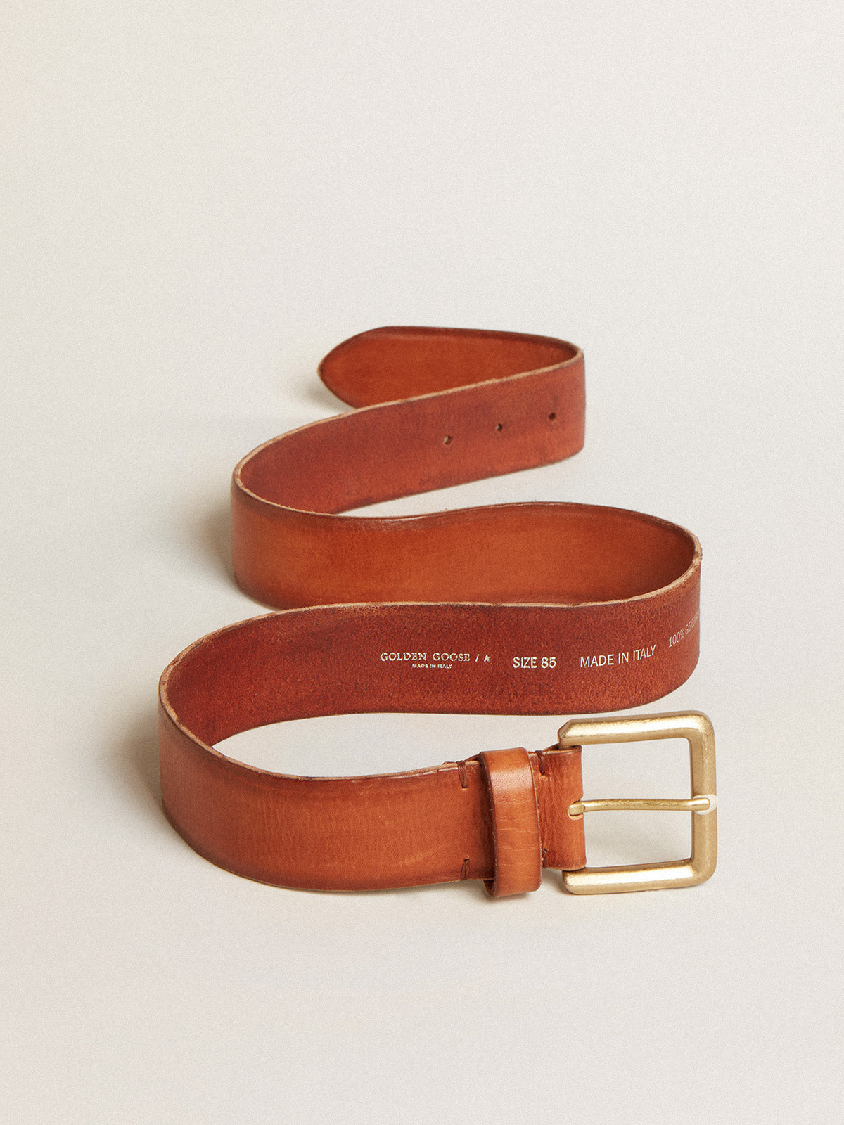 Belt in tan-colored washed leather with raised print| Golden Goose