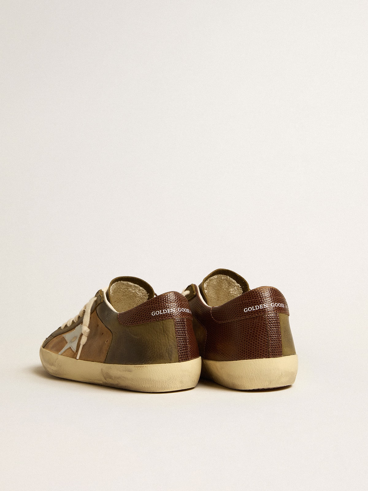 Super-Star LTD in green leather and tobacco-colored suede with silver star| Golden Goose