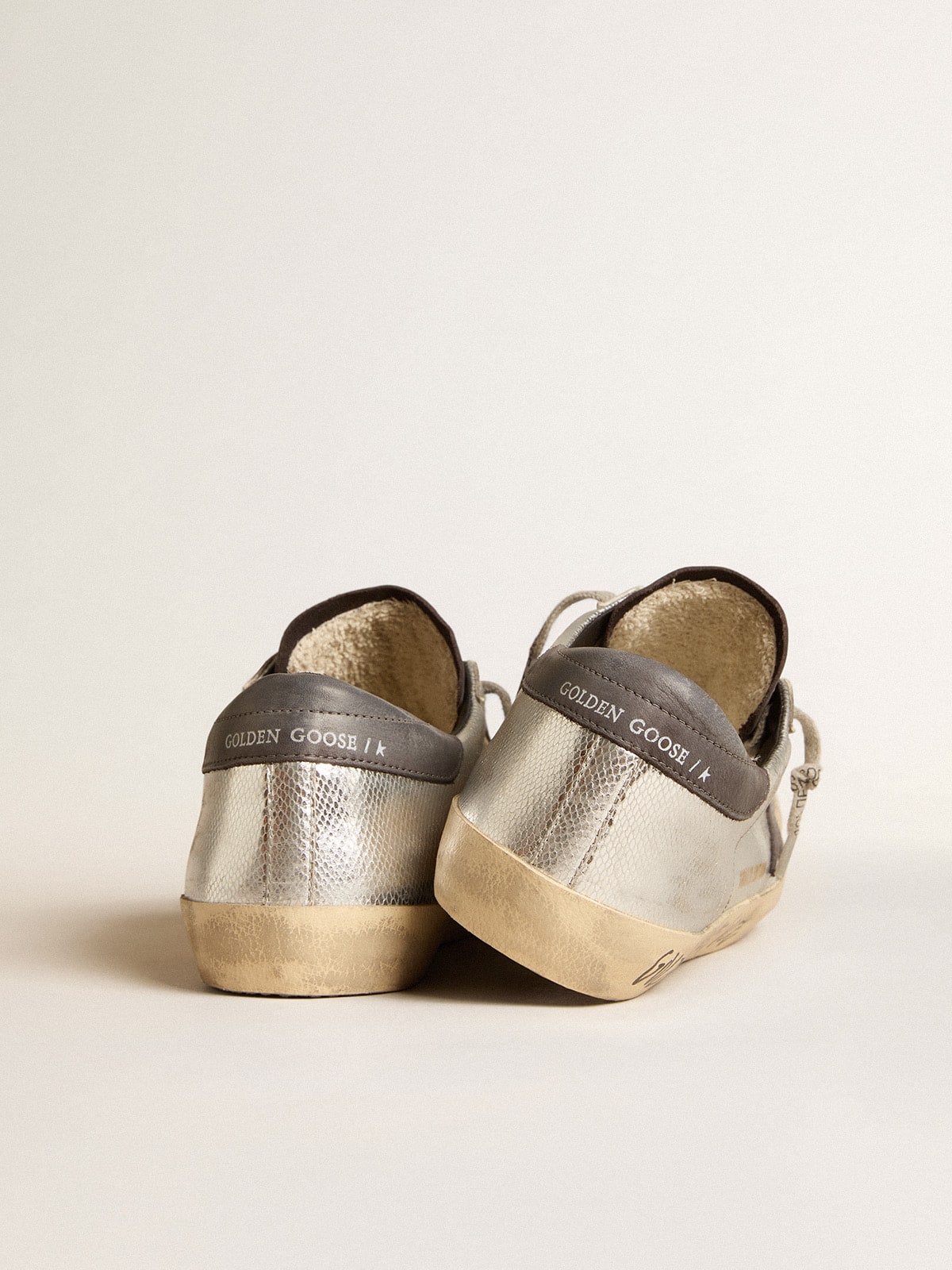 Men's silver Super-Star LTD with black nubuck star and heel tab| Golden Goose