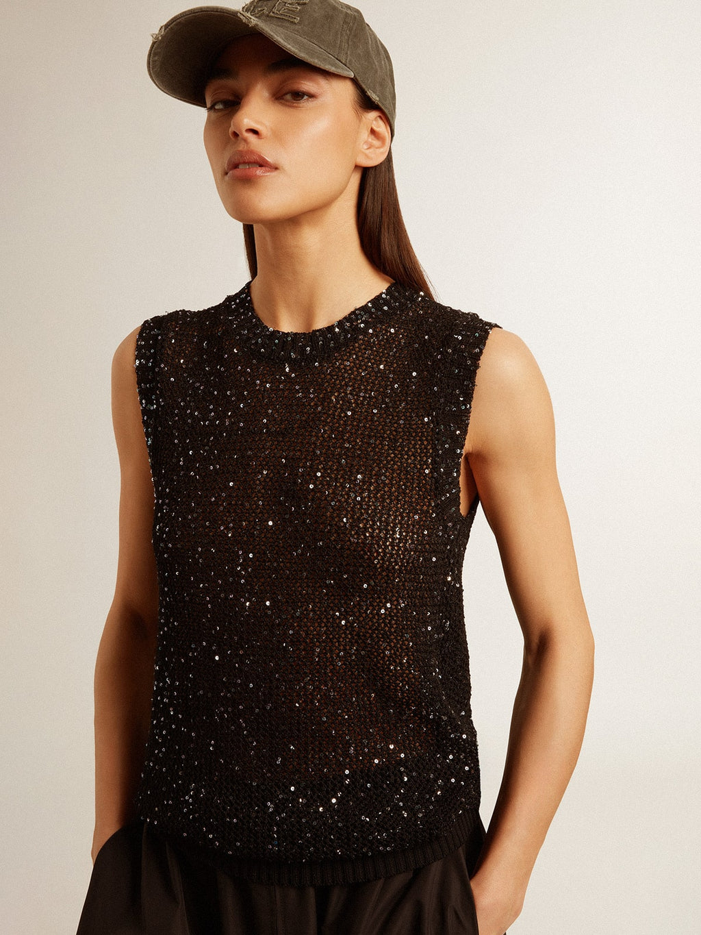 Black mesh knit top with sequins and contrasting details