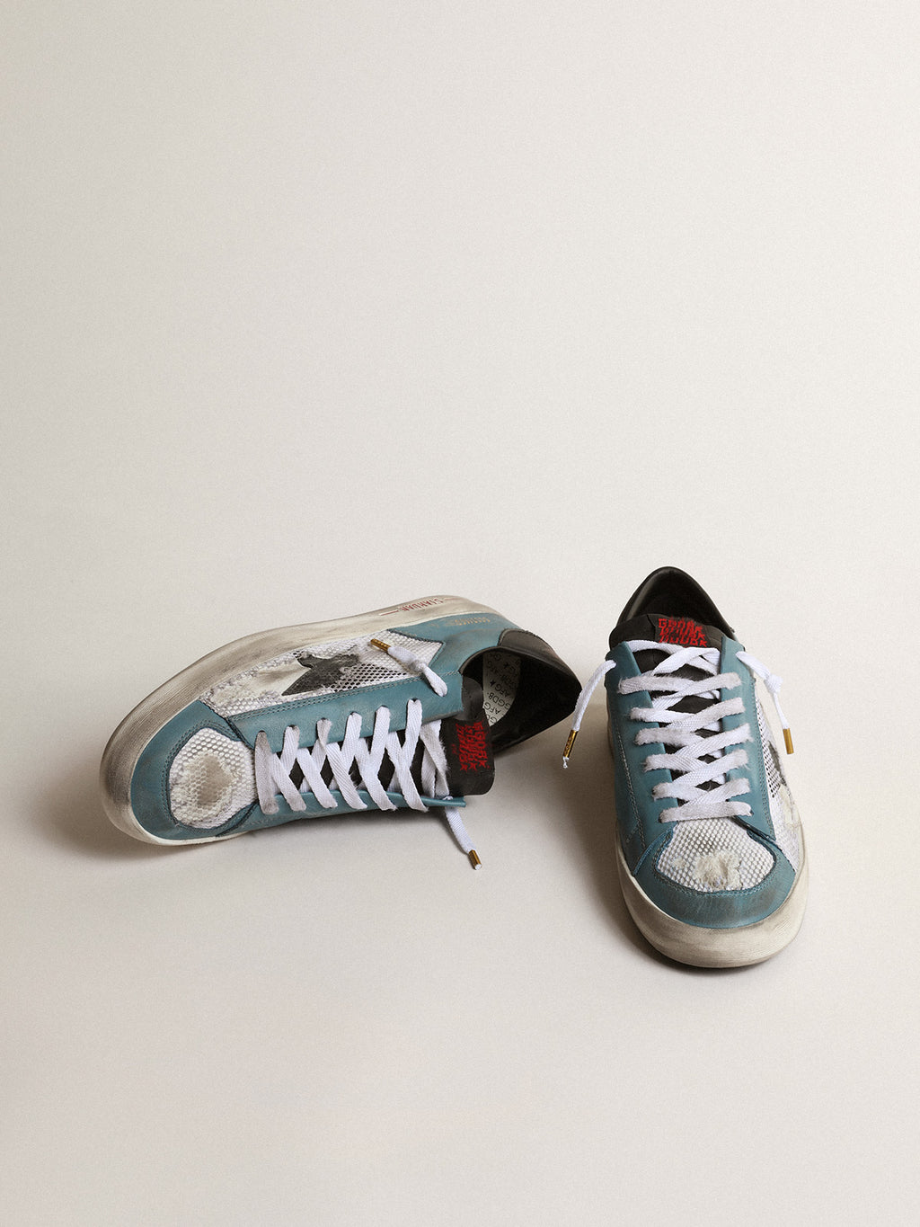 Men's Stardan in distressed mesh and petrol-colored upper| Golden Goose