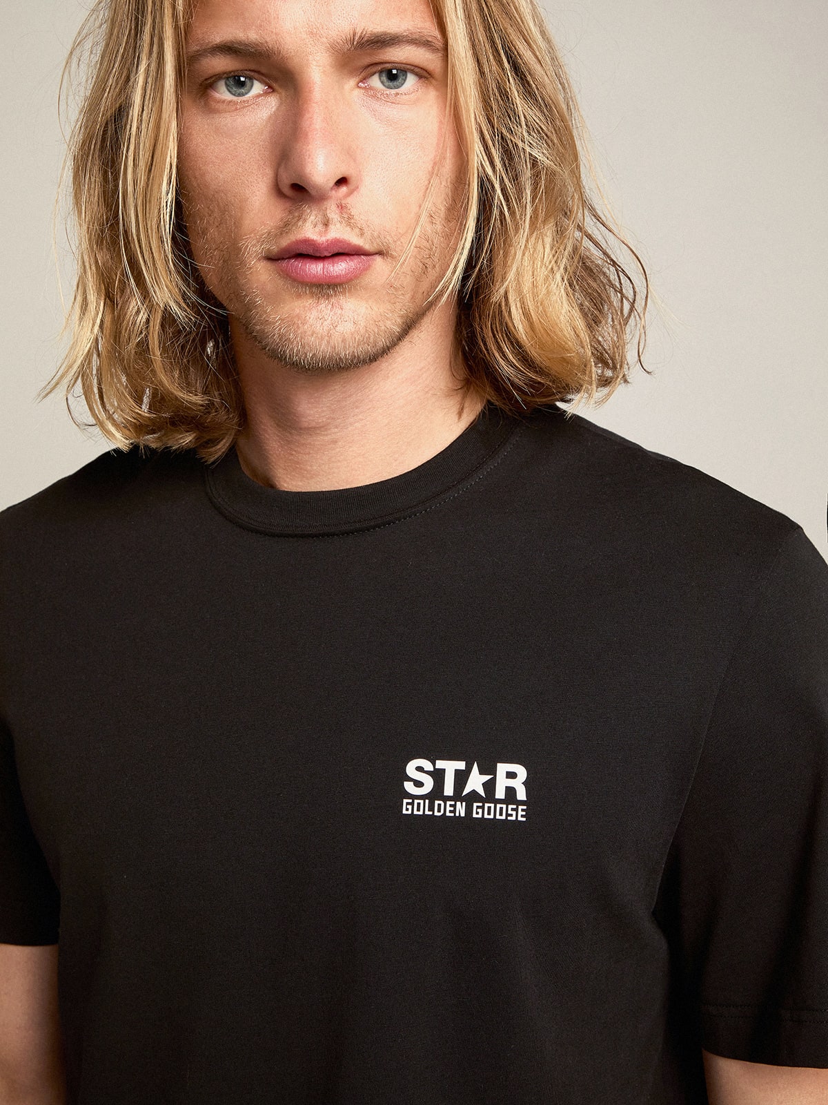 Men's black T-shirt with contrasting white logo and star| Golden Goose