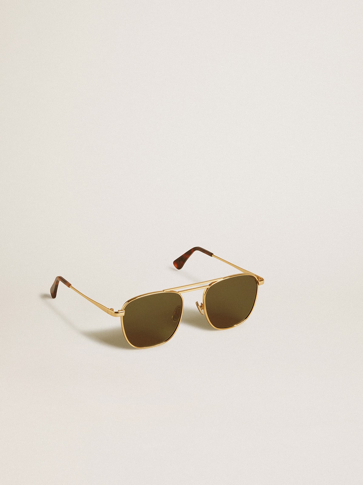 Aviator style sunglasses with gold frame and green lenses| Golden Goose